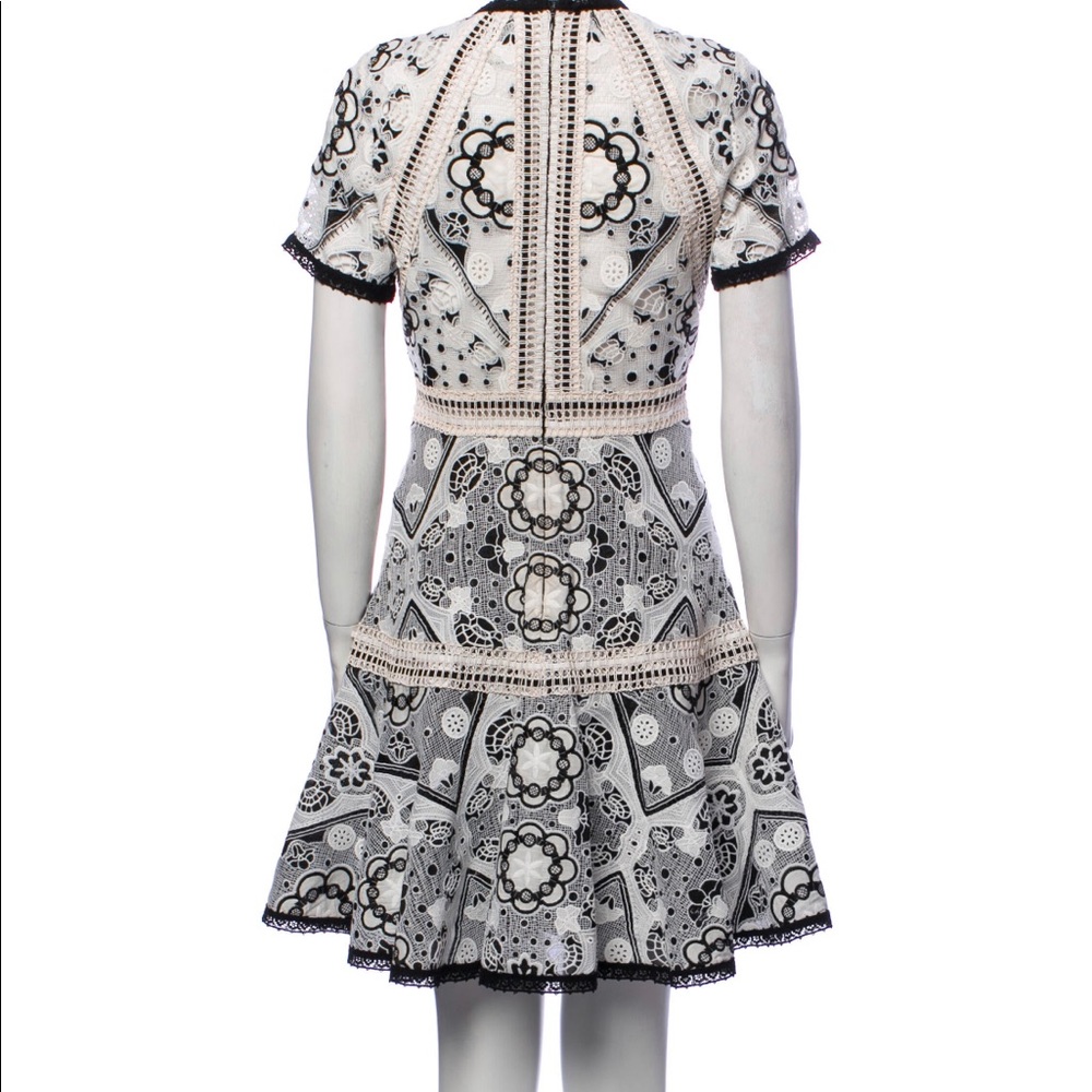 Gorgeous Alexis lace pattern mini dress. In good condition! Worn twice